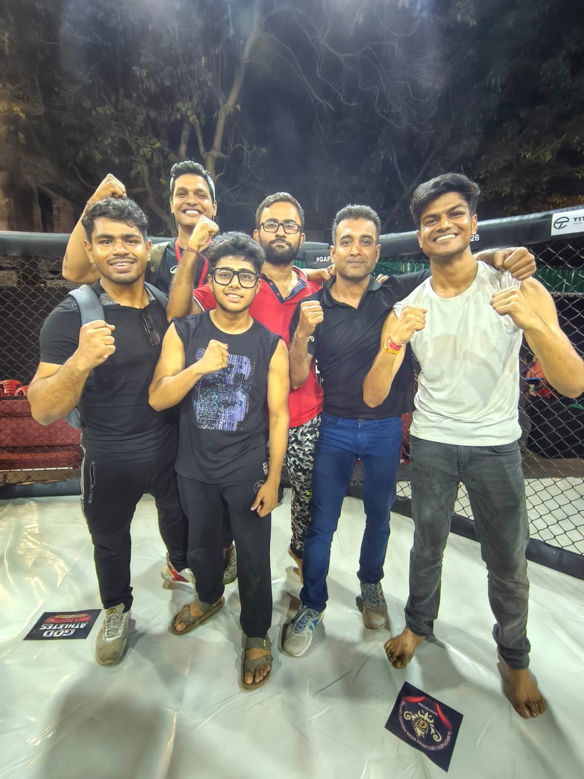 Fighters in the cage after a mixed martial arts event