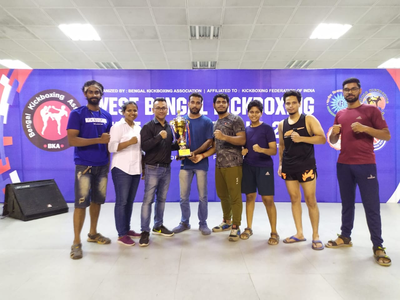Golds Combat Fight team with trophy at West Bengal Kickboxing Championship